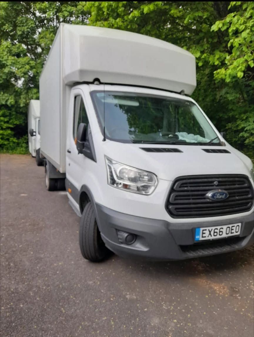 White Ford Transit Luton box van parked on a driveway
