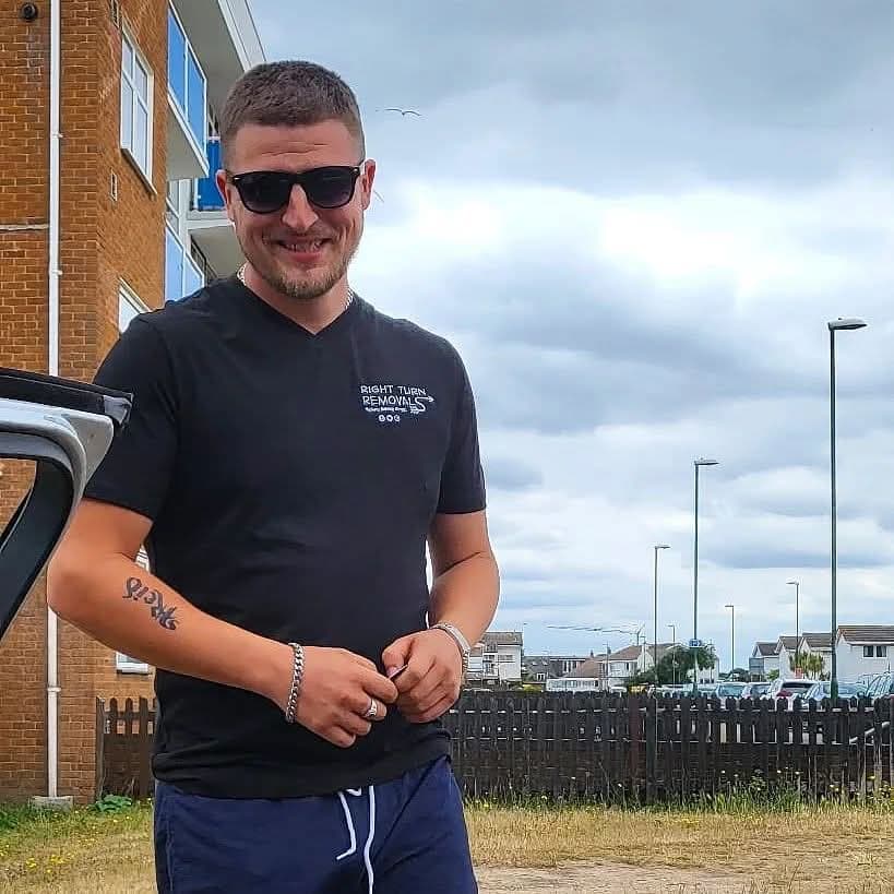 Lewis, owner of Right Turn Removals, in a branded t-shirt